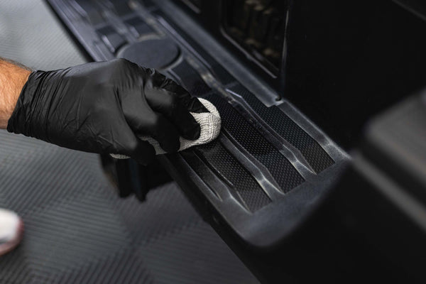 Armour Detail Supply Trim Plus on an applicator being applied to black trim.