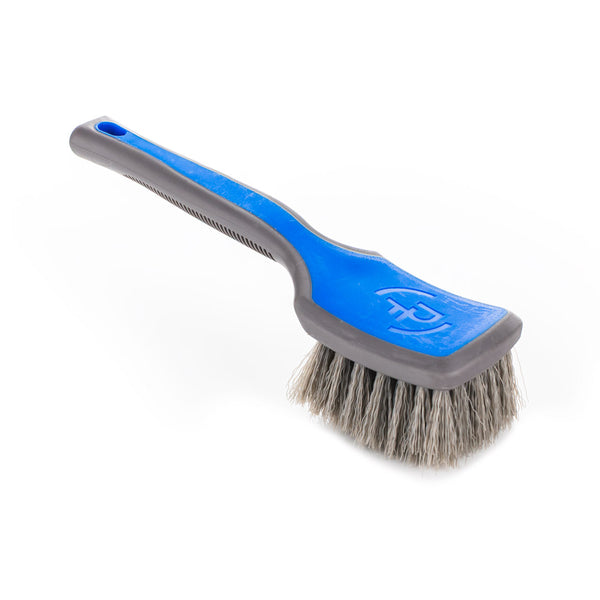 Detail Factory Tire Scrub Brush Avalanche handle view on a white background.