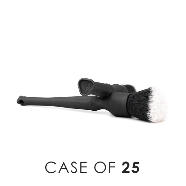 A small and large black Detail Factory Trigrip Brush crossing each other on a white background with the text 'Case of 25'.