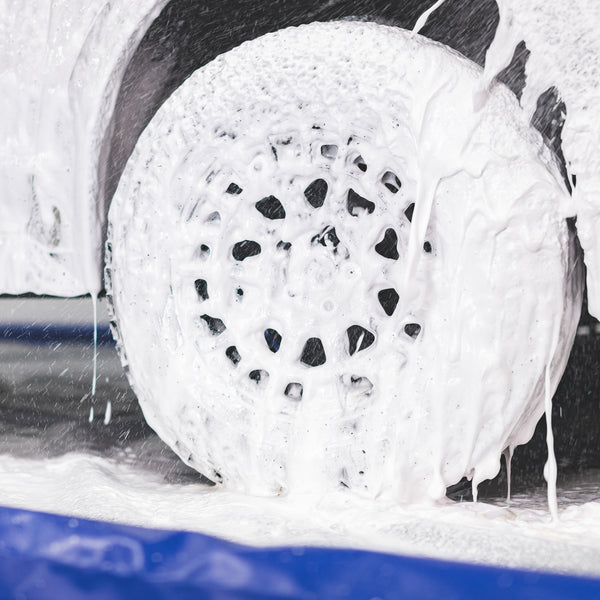 A car tire covered in foam.
