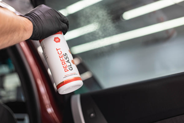 Gtechniq G6 Perfect Glass spraying on window of a car.