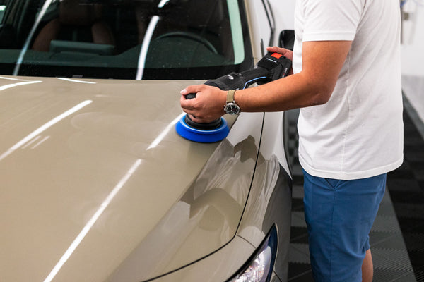 Koch Chemie Lack Polish Grun p1.03 being used with a polisher on a Mazda 3.