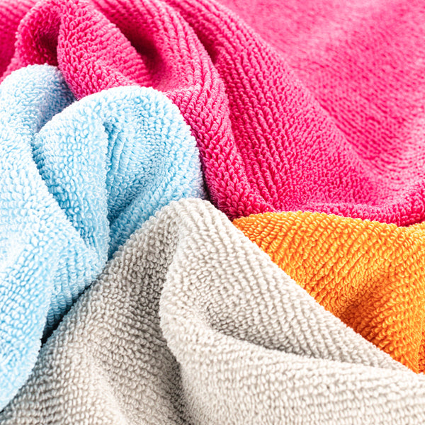 FTW 16 x 16 Pink, Light Blue, Ice Grey, and Orange towels in a pile.