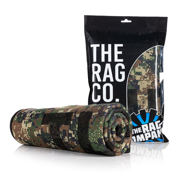 The Rag Company Slim Dryer Digital Camo 25 x 35 rolled towel next to packaging on a white background.