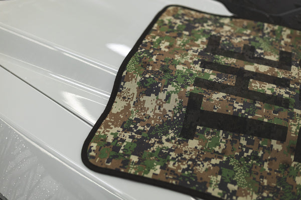 Slim Dryer Digital Camo towel being used to wipe down the hood of a Ford Raptor.