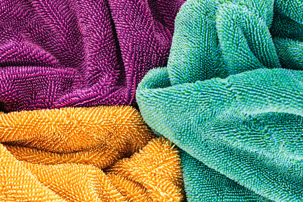 The Liquid8r Colorburst all color option view with towels scrunched together close up view.