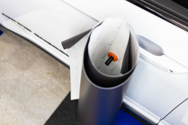 A close up of a Yellotools Speedmag in the inside of a role of vinyl.