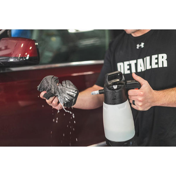 A person spraying an Ultra Safe Sponge with an IK Sprayer.