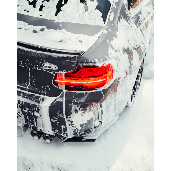 The back of a car covered in foam.