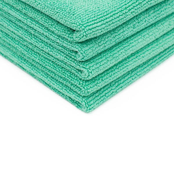 A close-up shot of a stack of 5 Pearl towels from The Rag Company in a green color, measuring 16 inches by 16 inches.