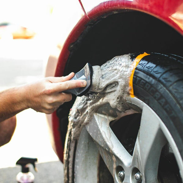 The Rag Company Wheel and Tire Brush Demo before and after cleaning a tire.