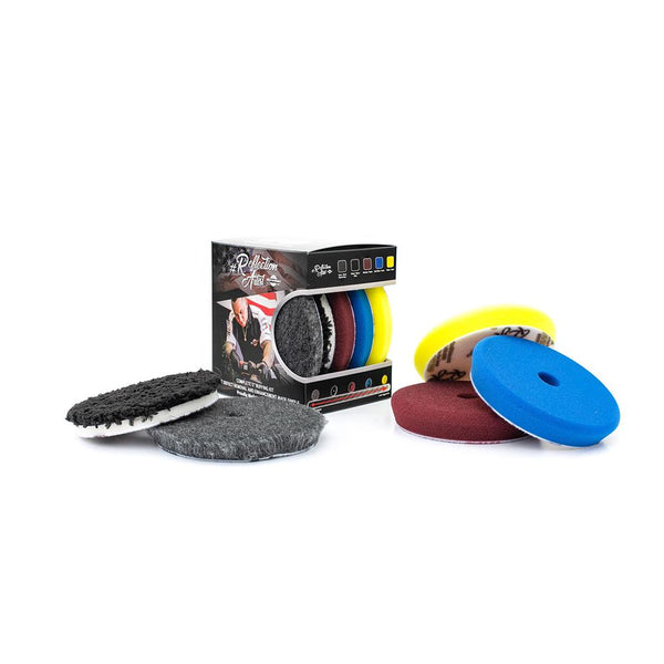 A Reflection Artist Buffing Kit with all of the buffing pads spread around a white background.