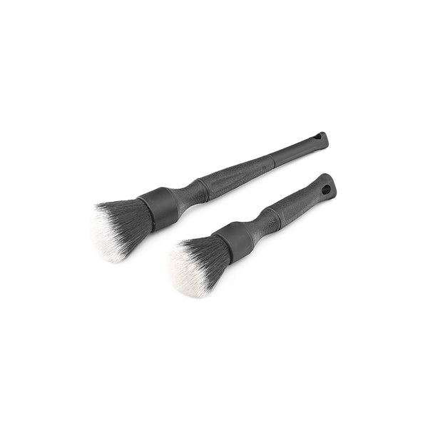 A long and short black Detail Factory Synthetic brush in parallel on a white background.