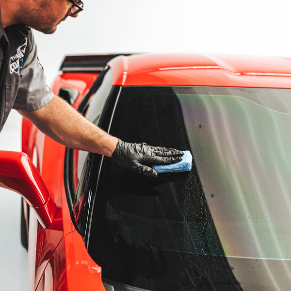 Using Diamond Glass from Diamond ProTech on the windshield of an orange C8 Chevrolet Corvette