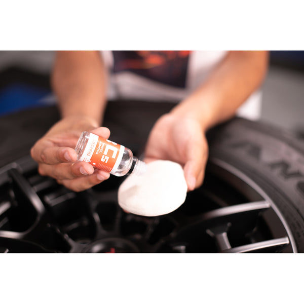 Using C5 Wheel Armor from Gtechnoq to coat the surface of a black Toyota TRD wheel