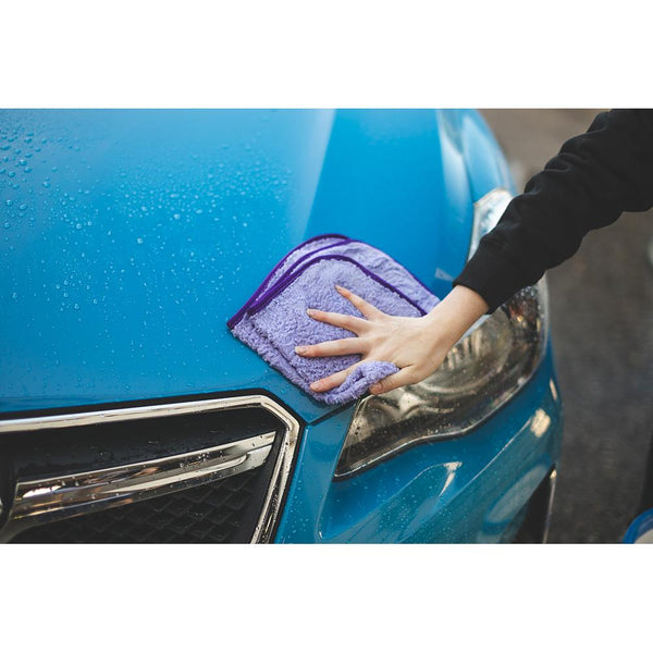The Rag Company Minx Royale purple towel wiping off a car demo.
