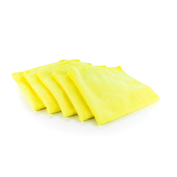 Five yellow microfiber towels spread across a white background.