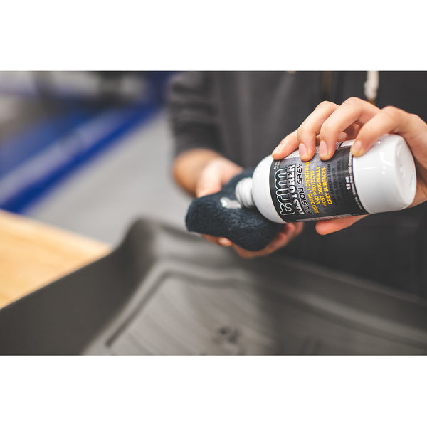 Solution Finish Fusion Grey Restorer used on a black terry applicator.