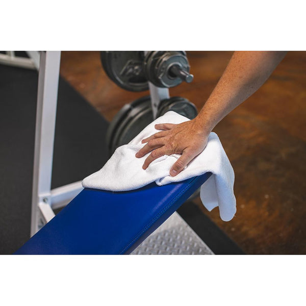 The Rag Company Spa and Workout white towel cleaning workout equipment.