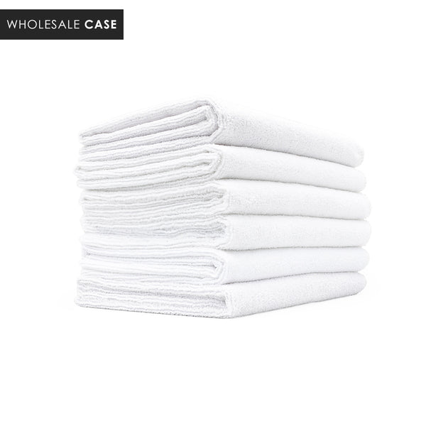 A stack of white spa and workout towels on a white background with the text 'Wholesale Case'.