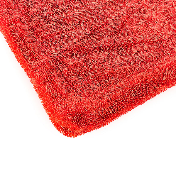 The corner of a red 1500 towel on a white background.