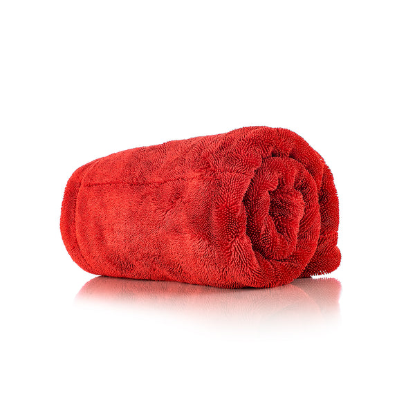 A red 1500 towel rolled up on a white background.