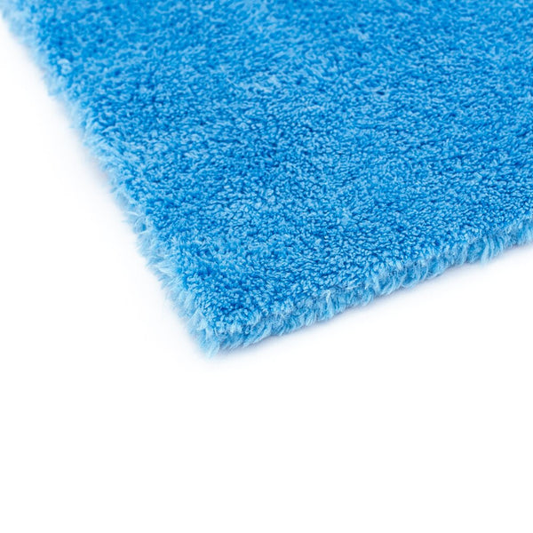 The corner of a blue Eaglet 500 towel on a white background.