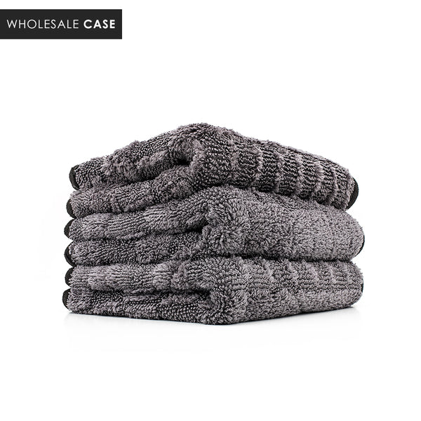 A stack of grey Gauntlet towels on a white background with the text 'Wholesale Case'?