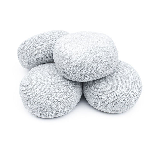 A 4-pack of Pearl Puck Applicators from The Rag Company in Ice Grey. These pearl weave microfiber applicators have a no-soak barriers inside them that prevents precious coating products from seeping into the sponge. 