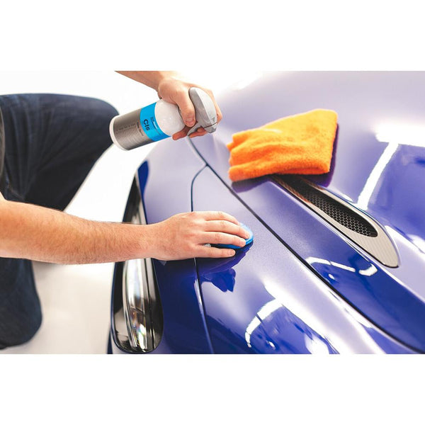 Koch Chemie Clay Spray 500ml bottle and Ultra Clay Bar cleaning a car.