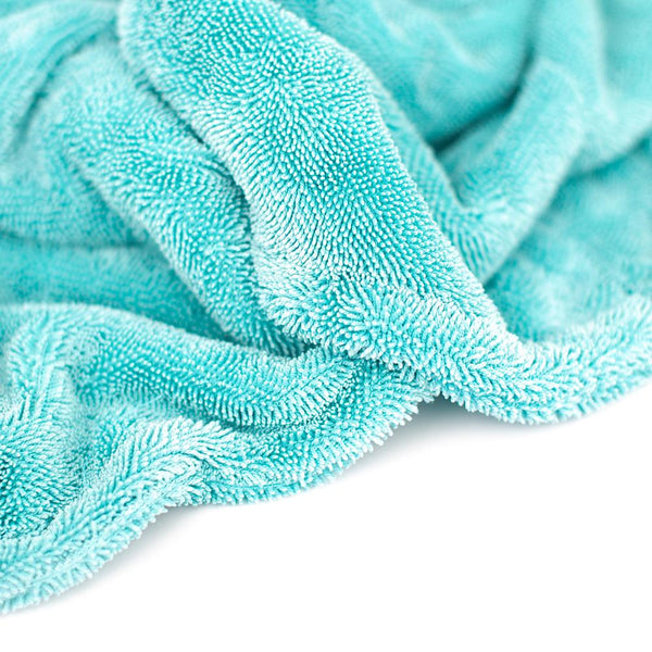 A closeup of the Twist Loop Drying Towel on a white background.
