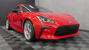 Freshly washed red sports car in The Rag Company studio
