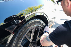 Terry Sponge black 3x5 applying product to tire.