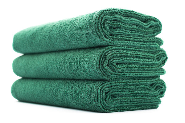 A stack of green sport workout towels.