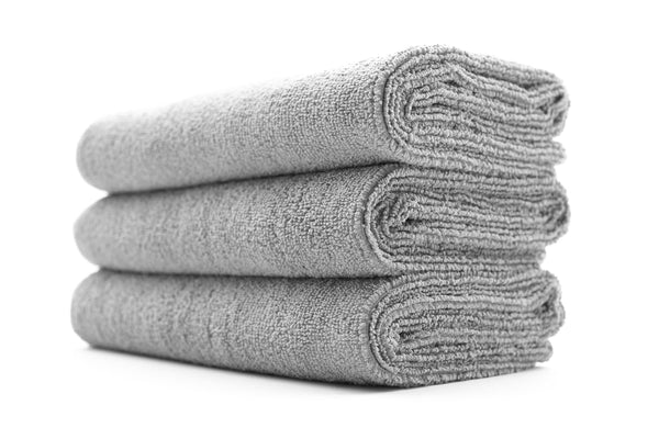 A stack of grey sport workout towels.