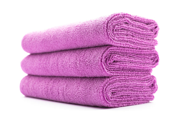 A stack of pink sport workout towels.