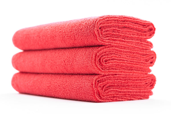 A stack of red sport workout towels.