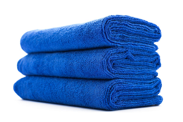 A stack of blue sport workout towels.