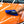 A closeup of a person wiping an orange car hood with a blue towel.