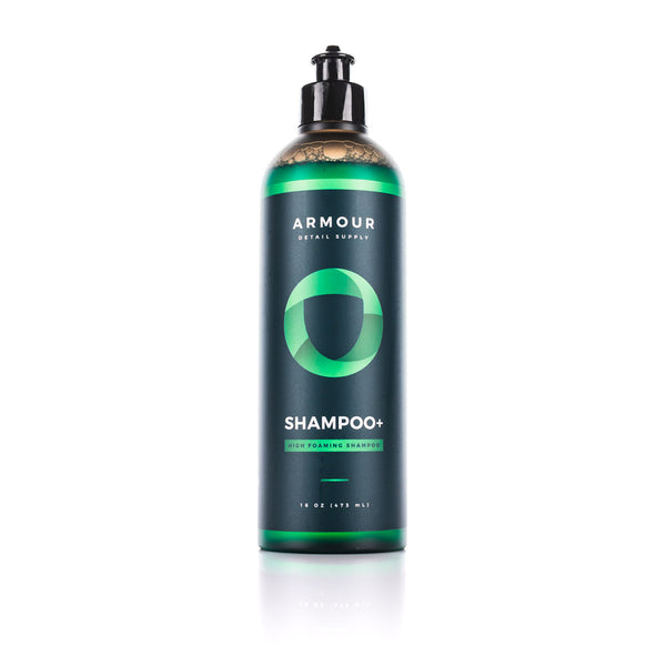 A bottle of Armour Detail Shampoo Plus on a white background.