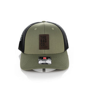A green TRC hat on a white background.