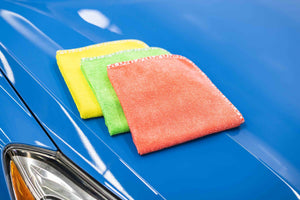 Citrus Twist layered on top of a blue car.