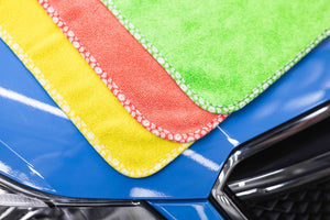 Citrus Twist layered corner view on top of a blue car.