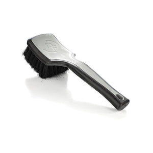 A grey Detail Factory Interior Scrub Brush on a white background.