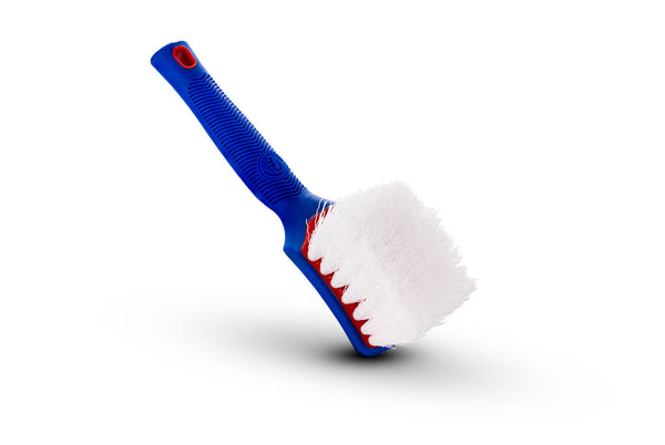 A red, white, and blue Tire Brush on a white background.