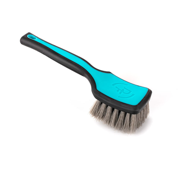 A Riptide Tire Brush on a white background.