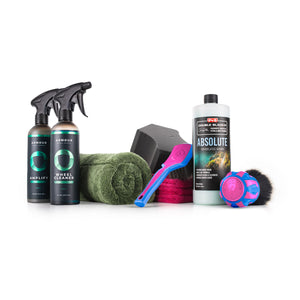 Collection of Diva Exterior Detail Bundle car care products including spray bottles, cloths, and a brush on a white background