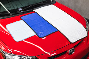 Dry Me a River size and color option view on the hood of a red car.