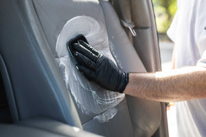 Interior scrubber 3x5 scrubbing a leather interior seat