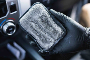 Interior scrubber 3x5 being held in a persons hand.